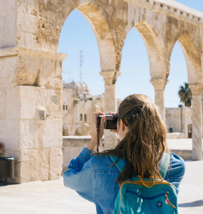 A vacationing photographer taking a picture.